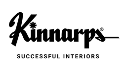 Logotyp för Kinnarps med företagsnamnet i svart och orange text.